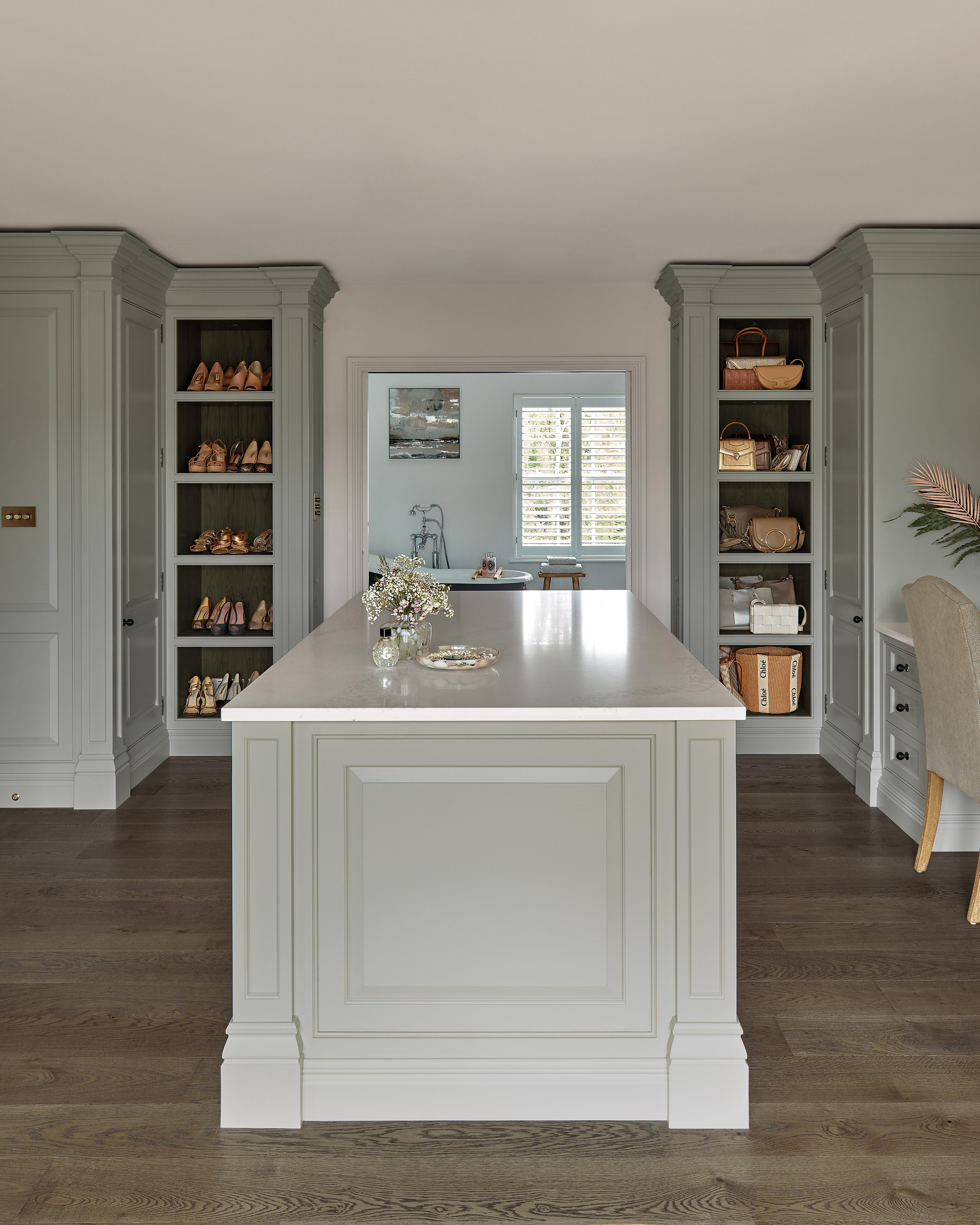 sage green bespoke dressing room with a central island