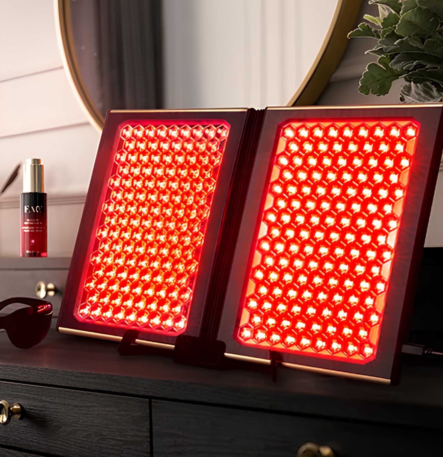FAQ Dual LED Panel red light therapy pictured on a vanity table lit up