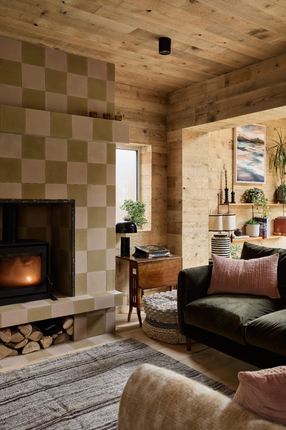 Pine wall and ceiling cladding pictured creates a cocooning effect in this sitting room 
