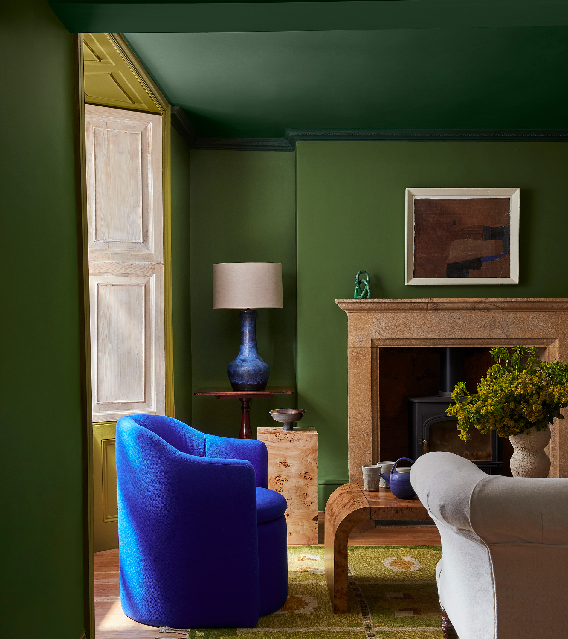 little greene green living room with blue chair