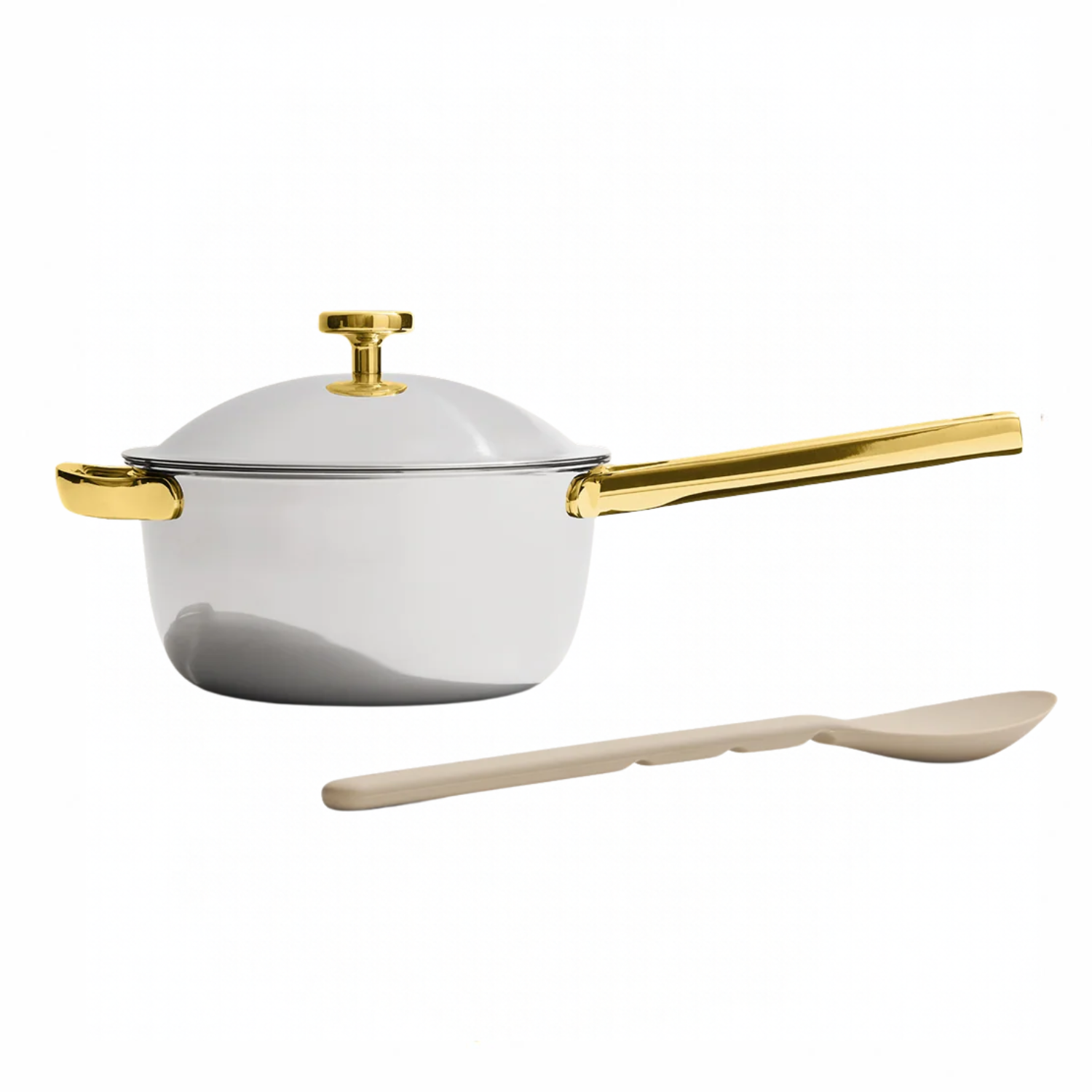 silver and gold saucepan with silicone spoon