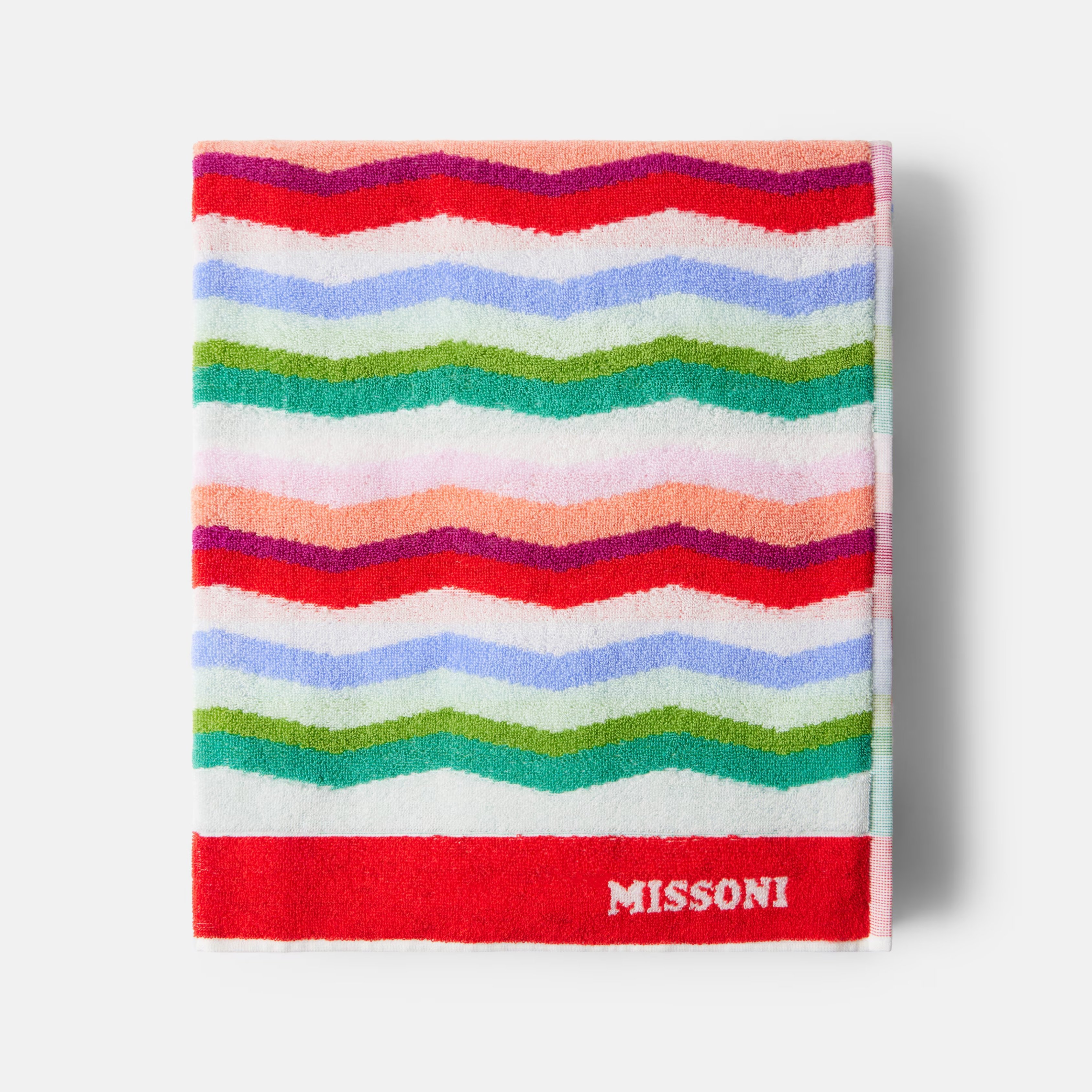 missoni luxury Wave Cotton Terry Beach Towel pictured folded on a grey background