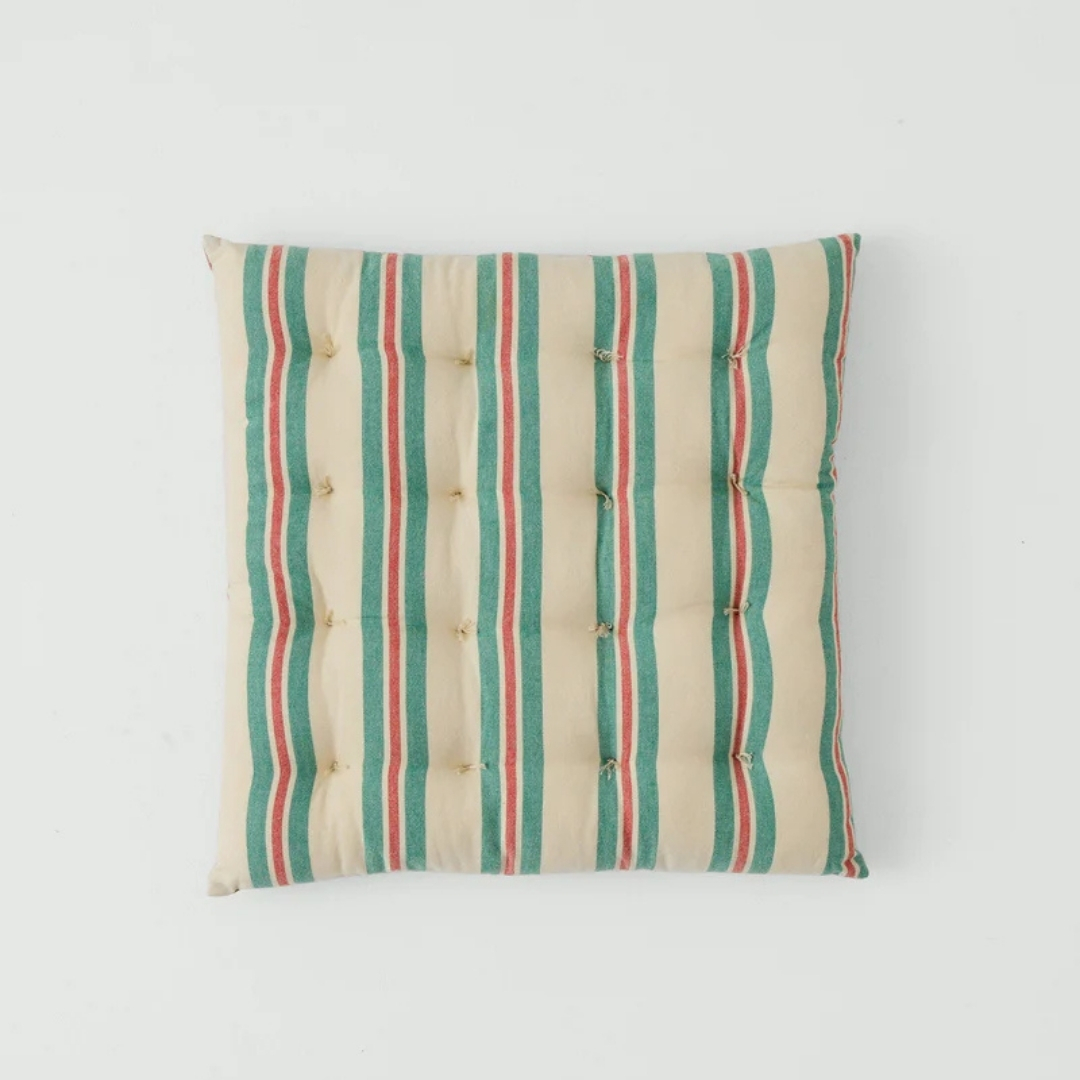 Toast Market Stripe Hand Woven Seat Pad pictured on a grey background