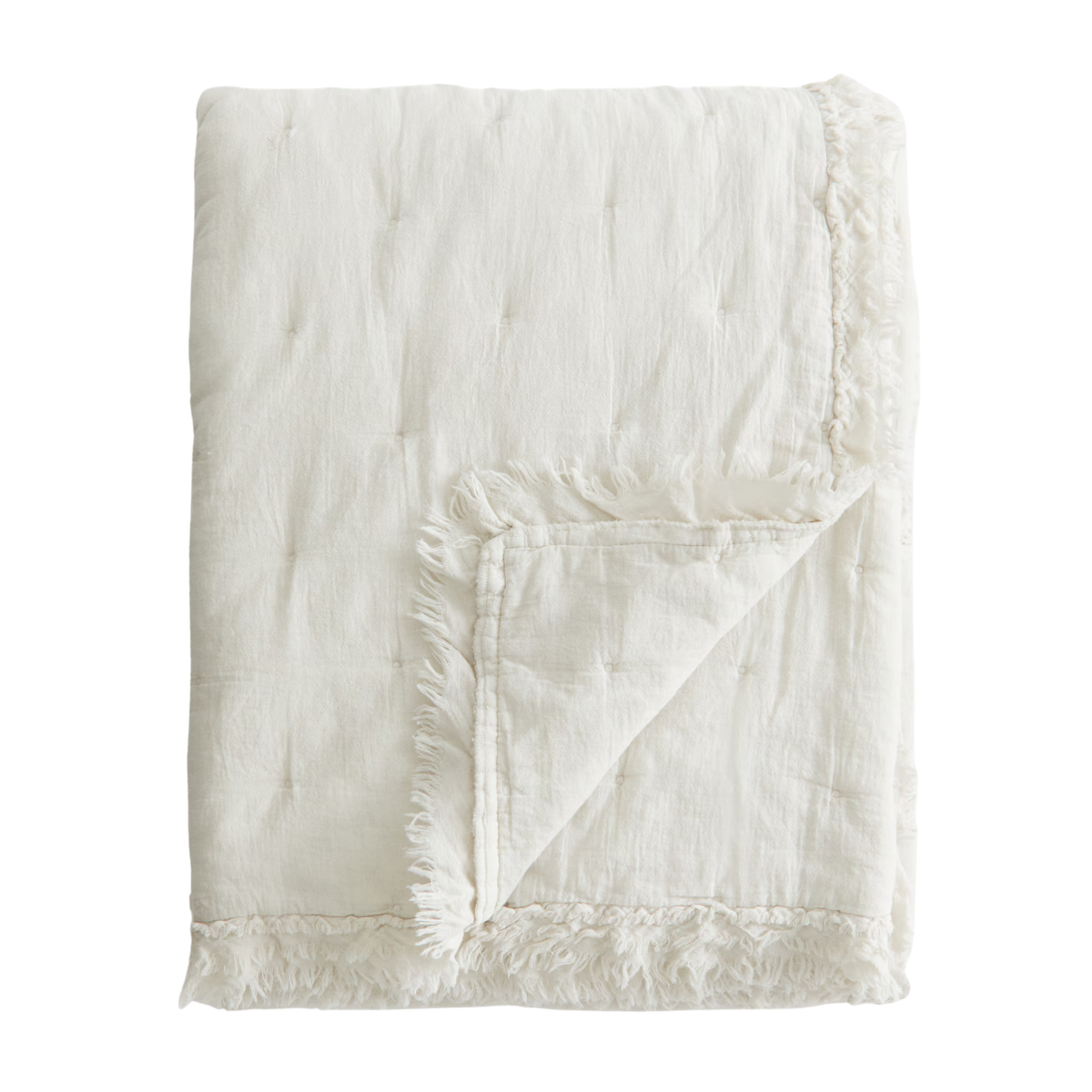 a white bedspread with a raw frilled trim