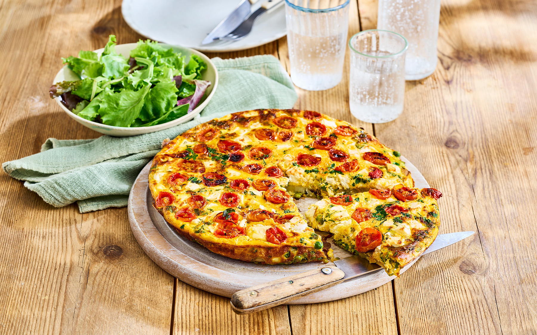 Pea, courgette, cherry tomato and feta frittata Recipe