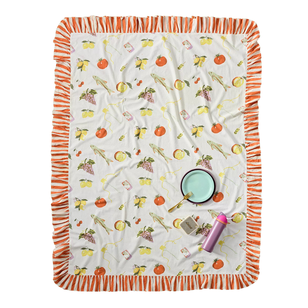 a table cloth with a white base covered in colourful fruit and an orange and white stripe ruffle edge
