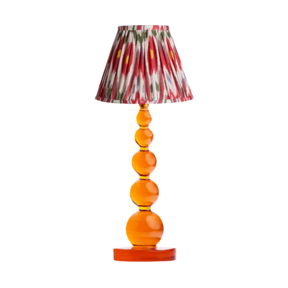 a lamp with a resin orange bobbin base and a red and white ikat pleated shade
