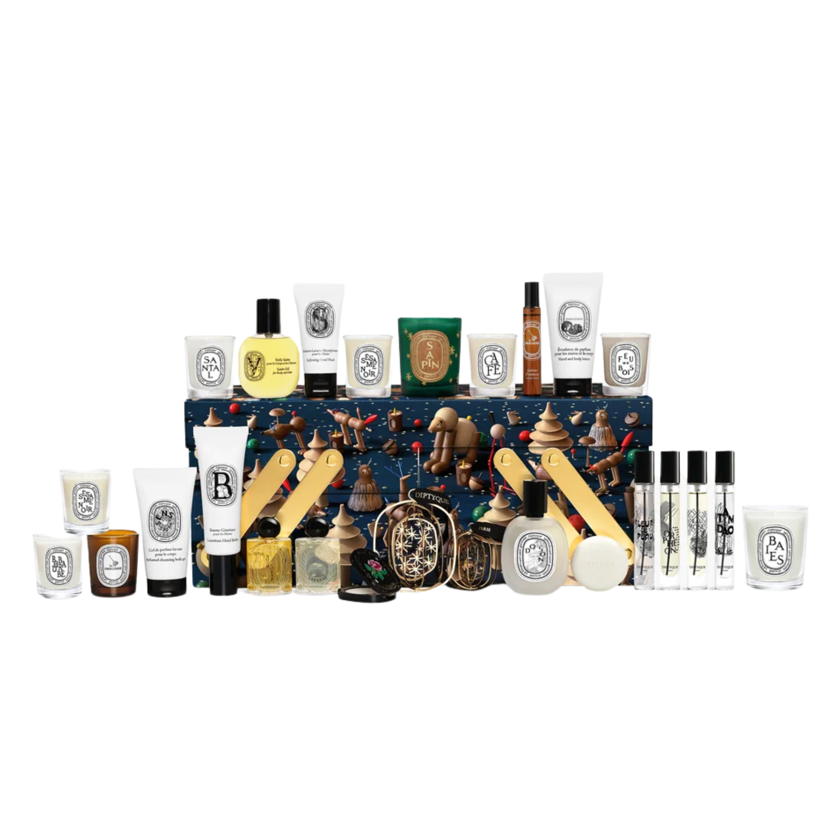 Diptyque Advent Calendar gift set featuring a dark blue illustrated box surrounded by mini candles, perfumes, lotions, and holiday decorations.