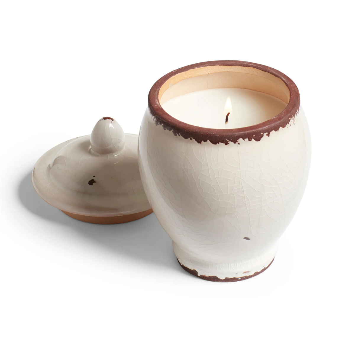 A WHITE AND TERRACOTTA CERAMIC URN SHAPED CANDLE