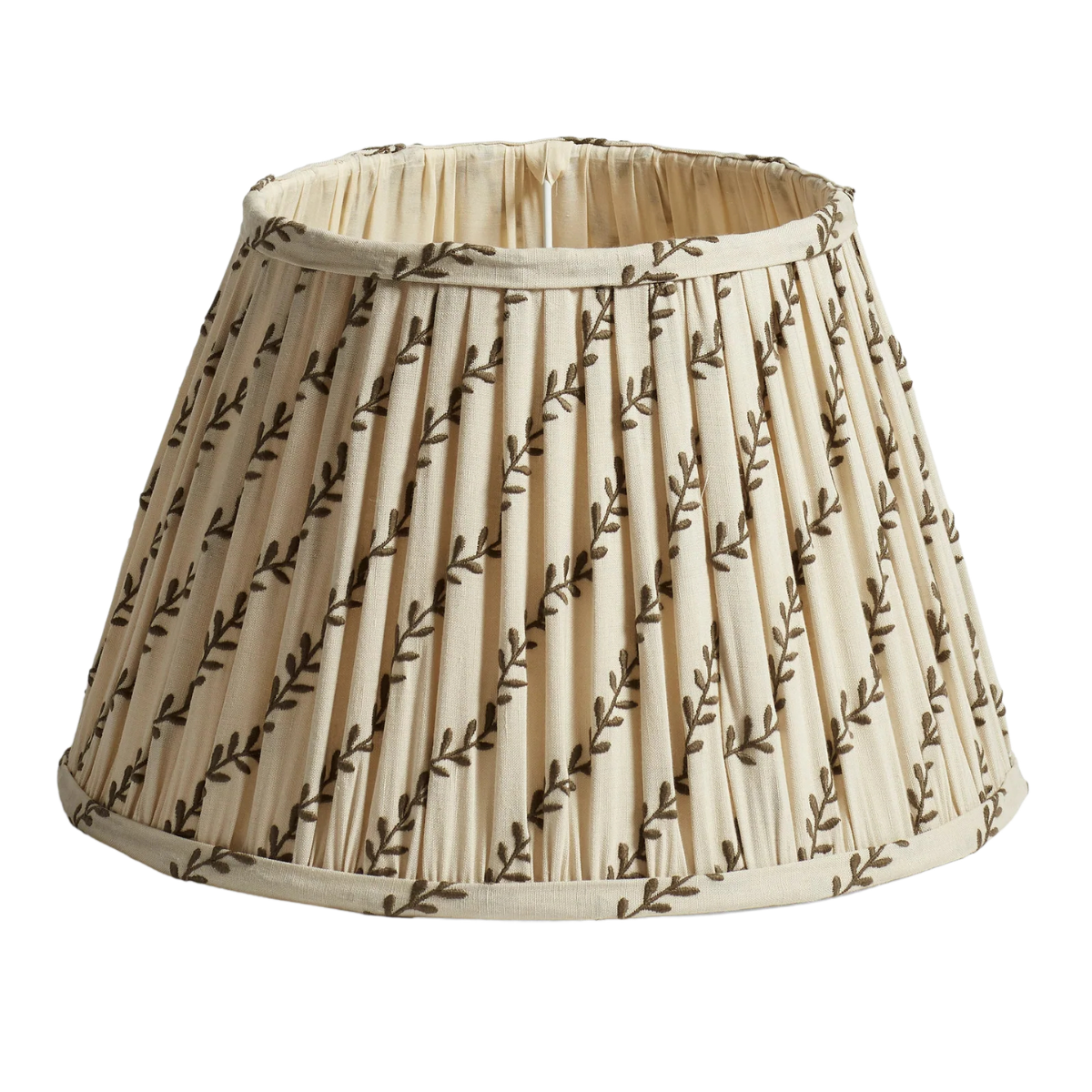 a cream pleated lampshade with leaf pattern