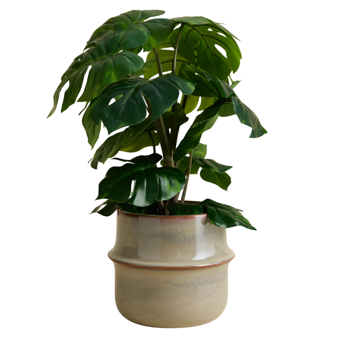 faux monstera plant in a beige ceramic pot