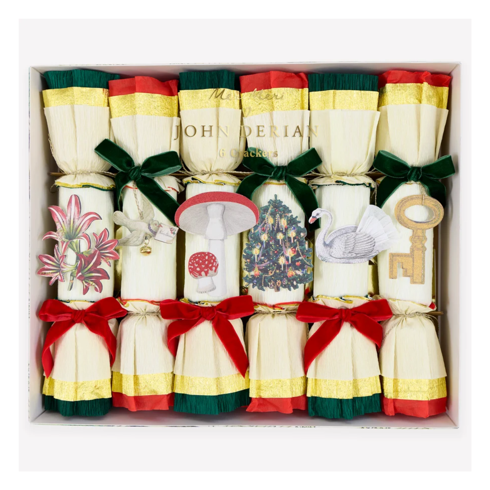 Boxed set of six Meri Meri x John Derian Christmas crackers in cream crepe paper with red, green, and gold accents and velvet bows. Each is topped with a vintage ornament cutout, including a flower, dove, mushroom, tree, swan, and key