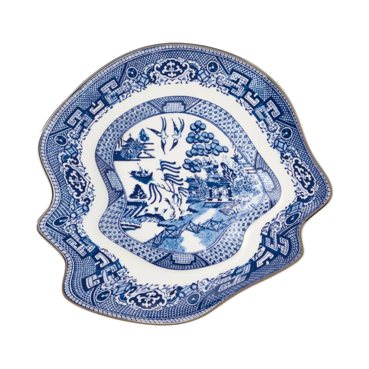 blue and white dessert plate with a wobbly edge