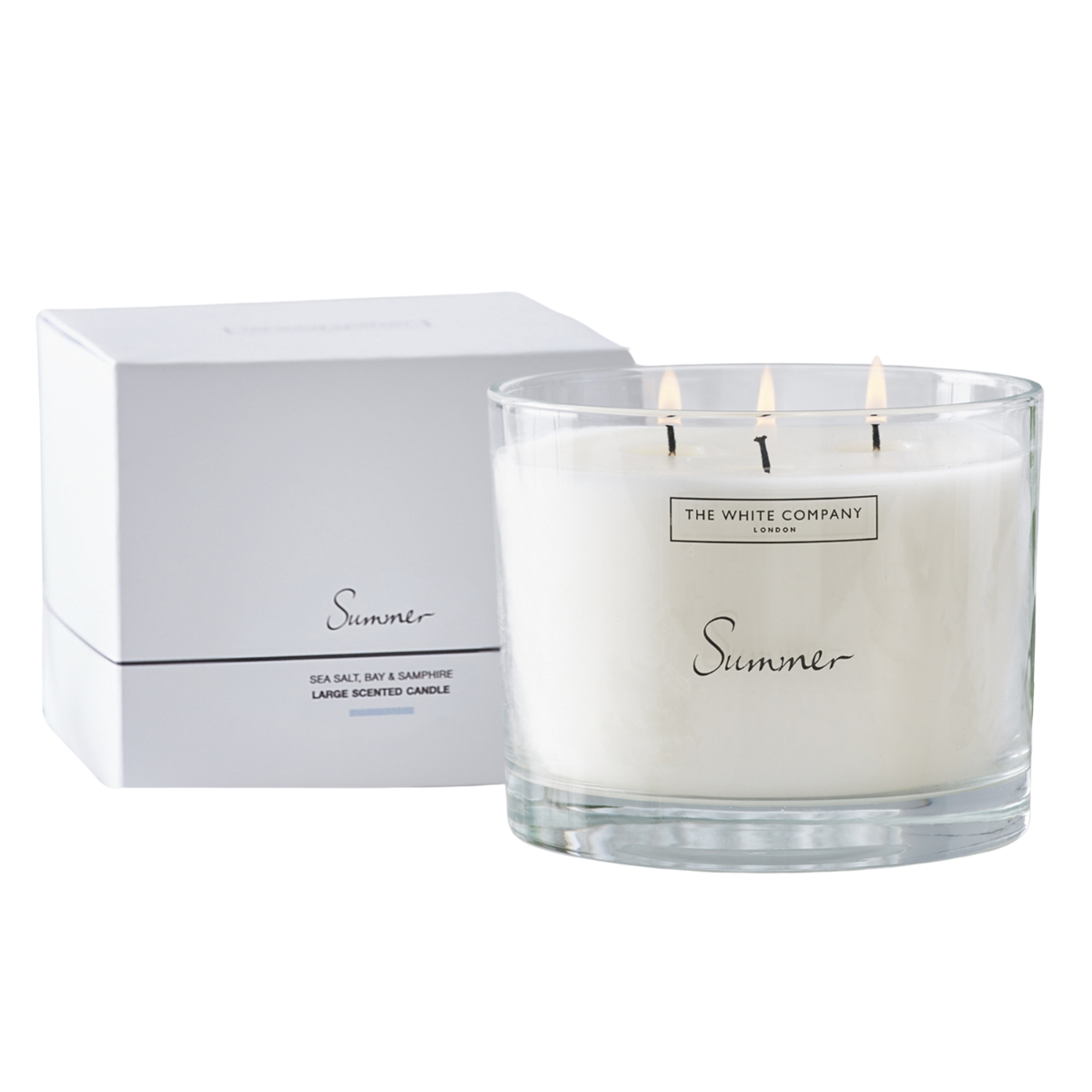 a large the white company summer candle with white box