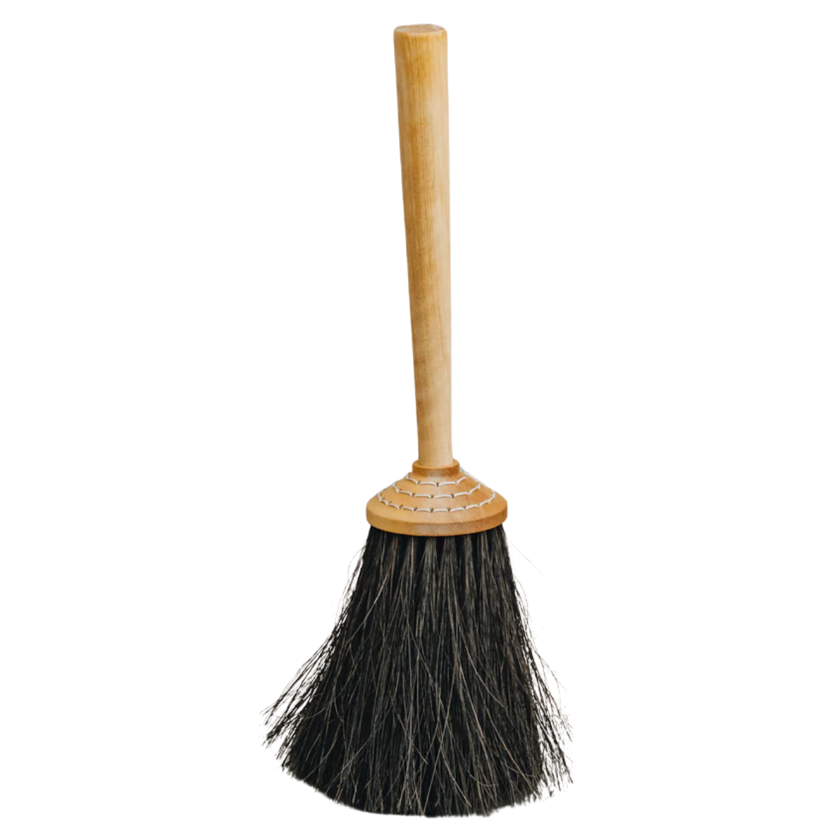 A traditional porch brush with a wooden handle and black bristles