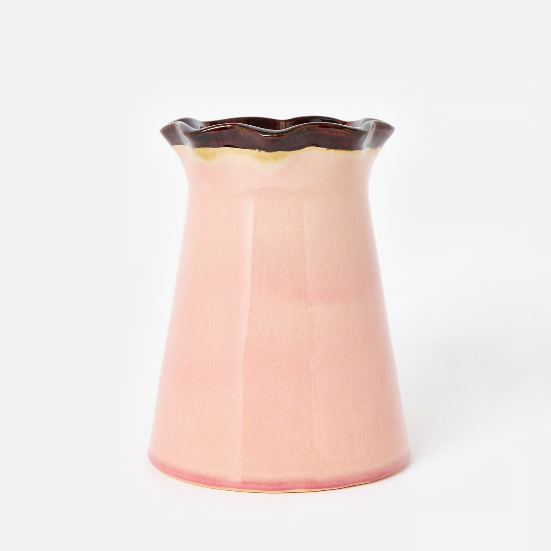 oliver bonas Isla Pink Ceramic Ripple Vase pictured with brown stripe on a grey background