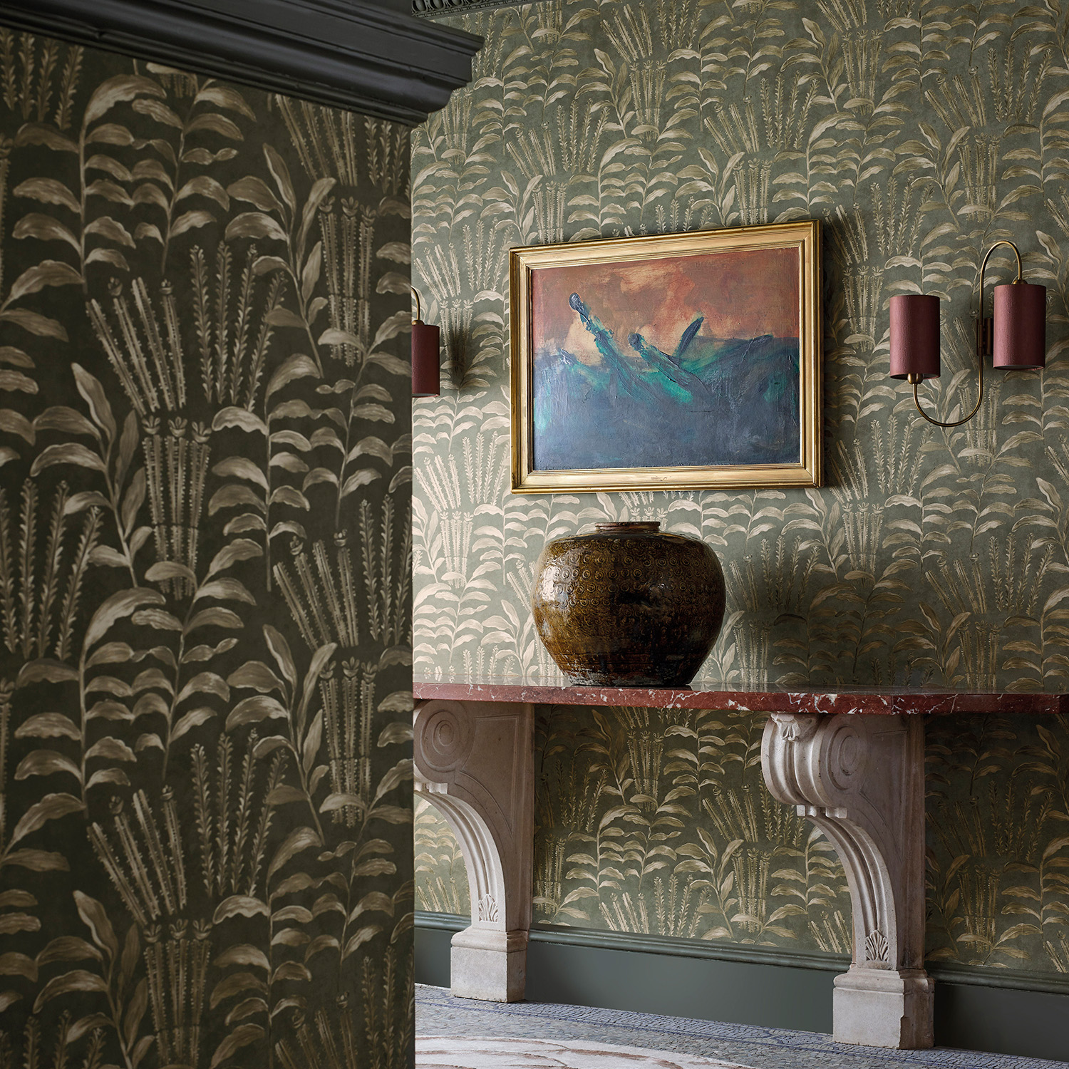 hallway with green botanical wallpaper and wall sconces