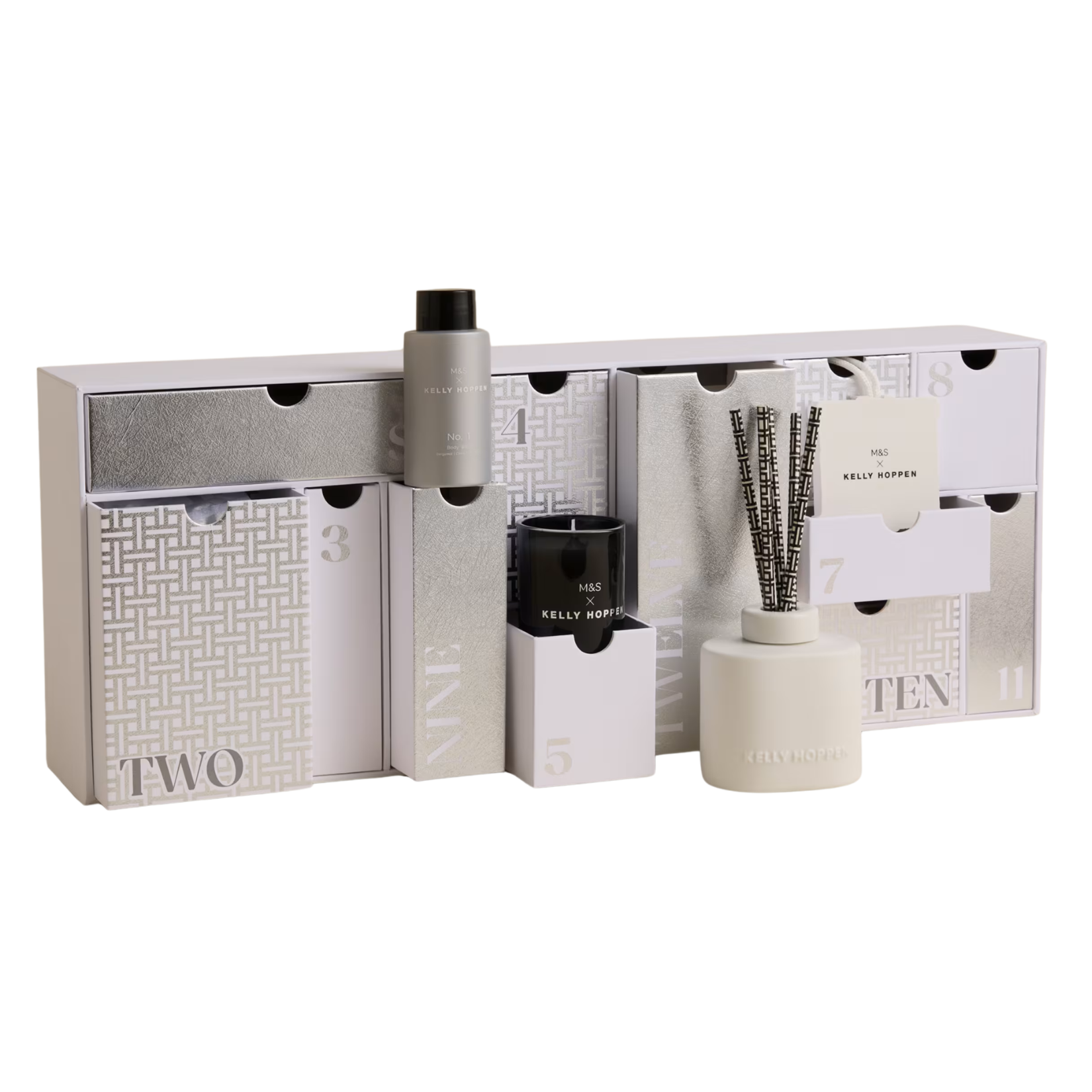 Marks & Spencer x Kelly Hoppen wellness advent calendar styled in neutral white, grey, and silver with pull-out drawers and home fragrance products