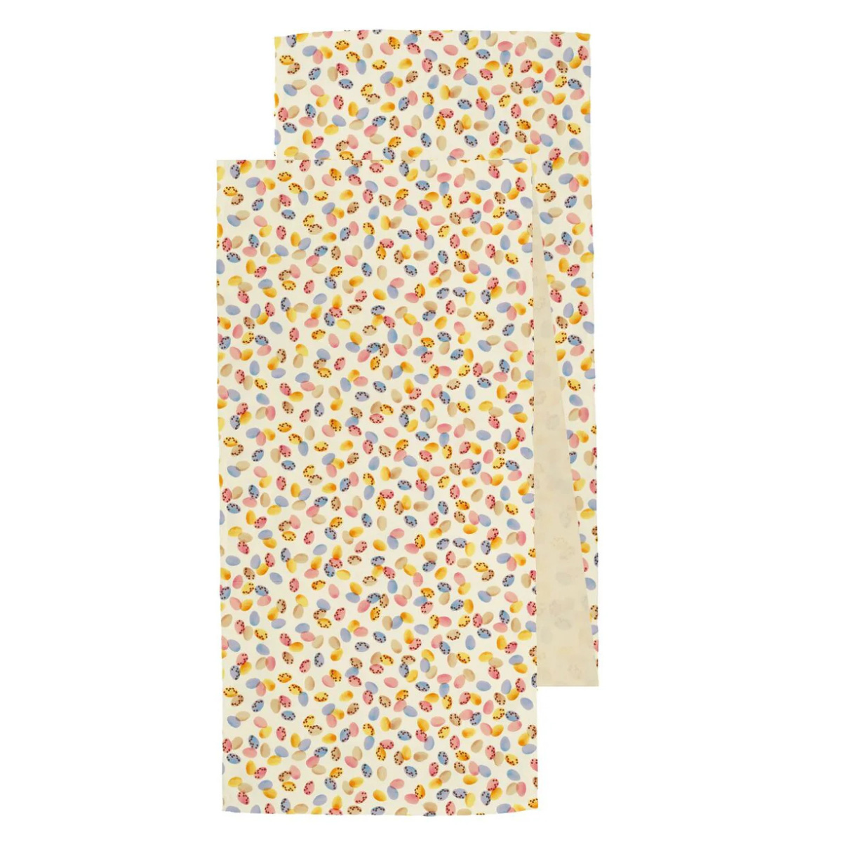 a table runner with mini eggs pattern