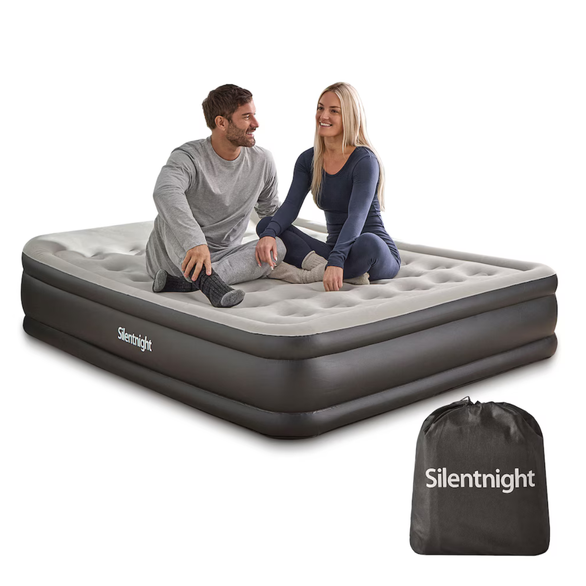 a black and pale grey air bed with a man and a woman sat on it