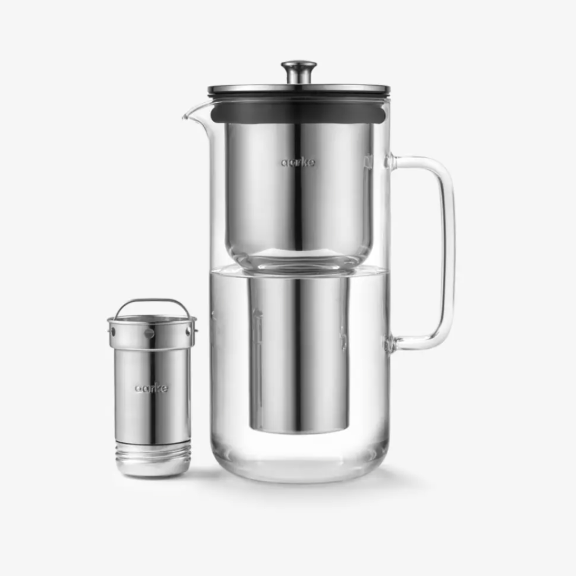 aarke purifier water filter pitcher in glass pictured in stainless steel on a grey background 