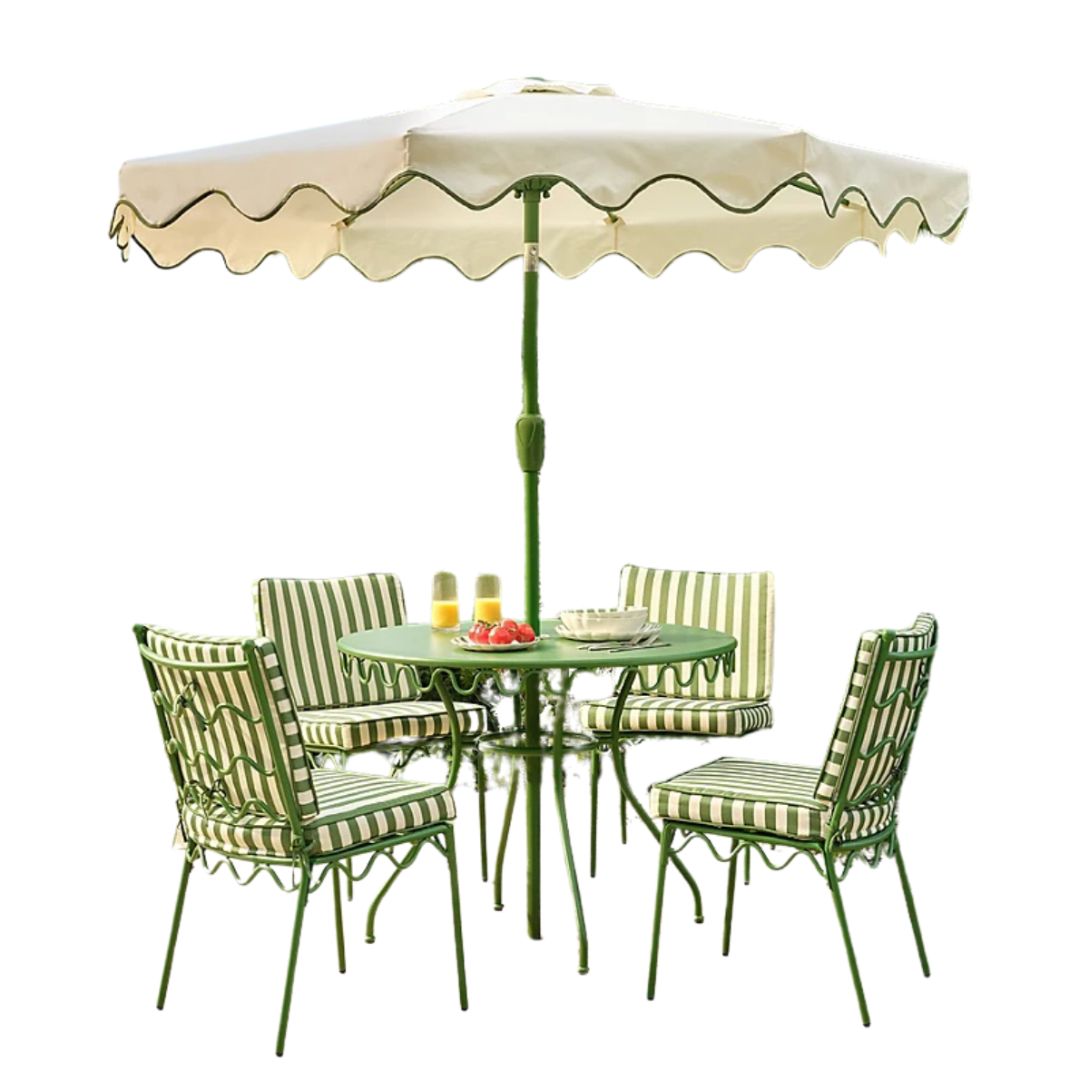 a green metal outdoor dining set with 4 chairs, green and white stripe seat pads and a cream parasol with a green scalloped trim