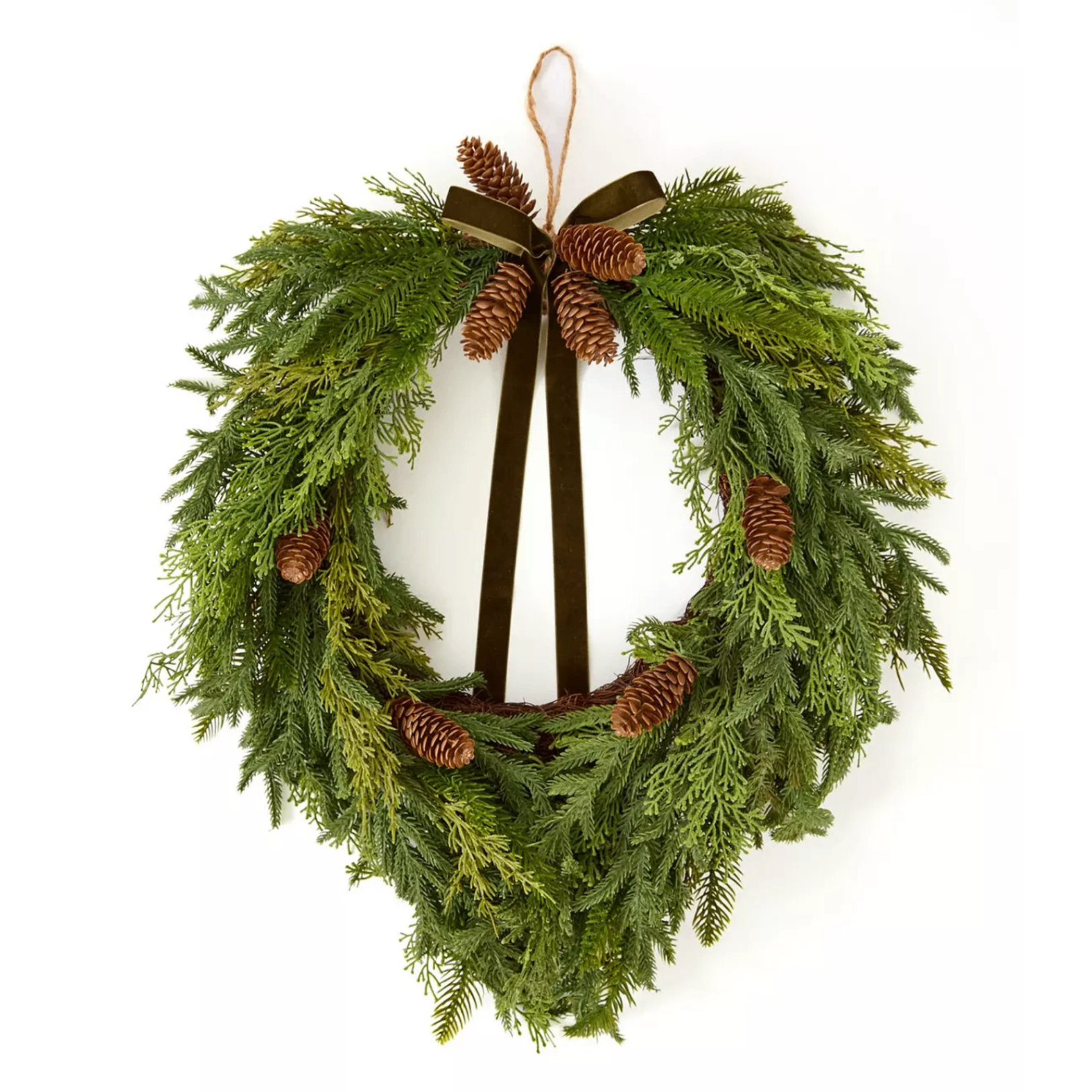 heart shaped xmas wreath with pine cones and a bow