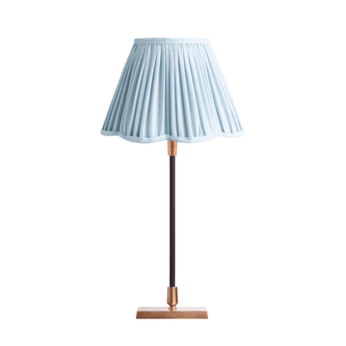 a pale blue pleated lamp with a scalloped edge shade