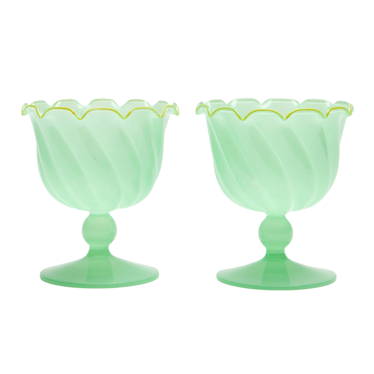 bright green coupe glasses with a ribbed detail and a scalloped rim