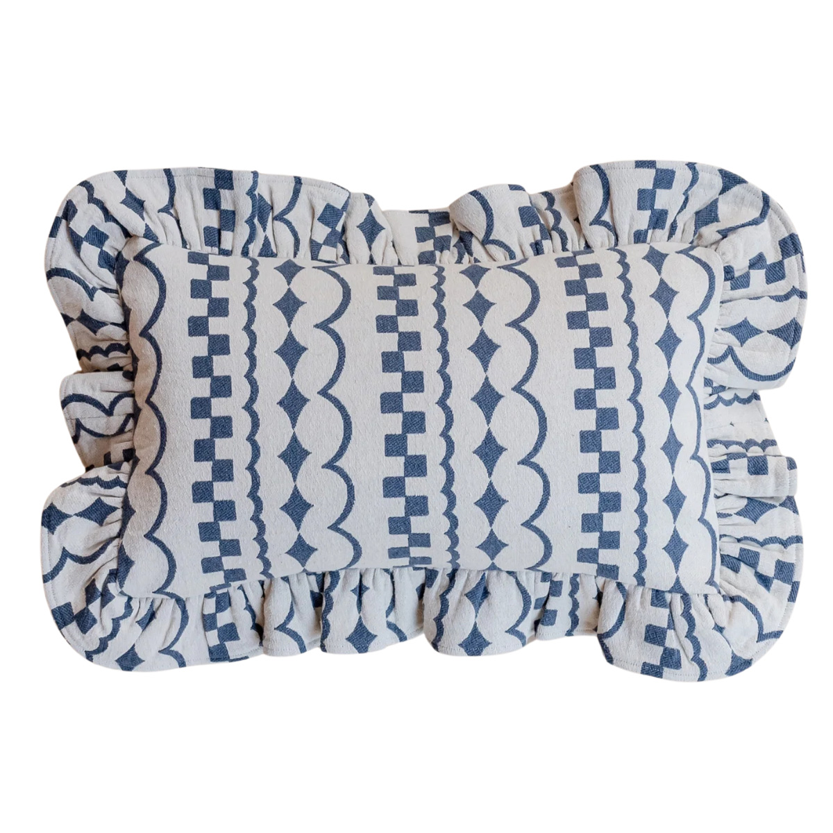 a white cushion with blue pattern and ruffled edges