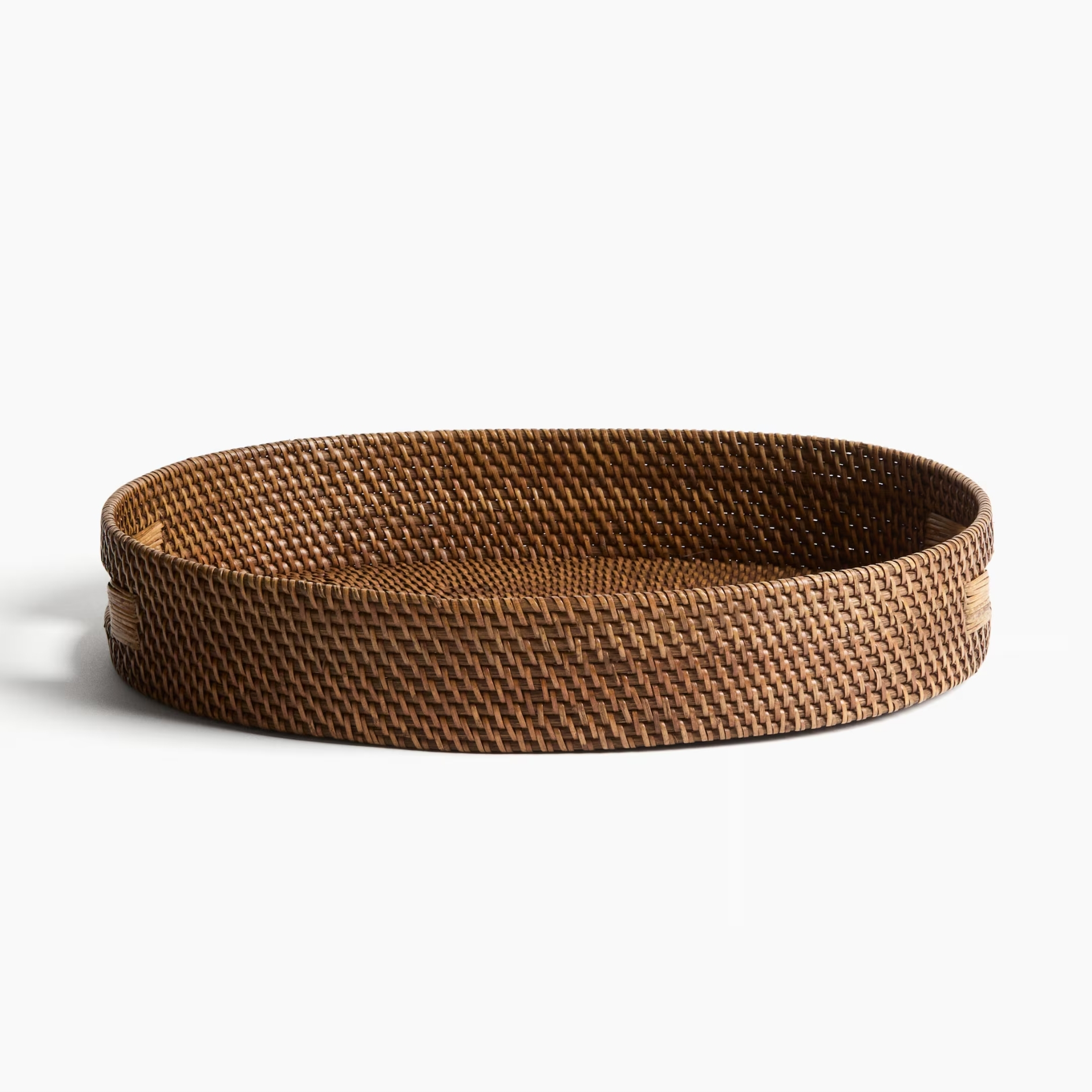 h&m Oval rattan serving tray pictured on a white background