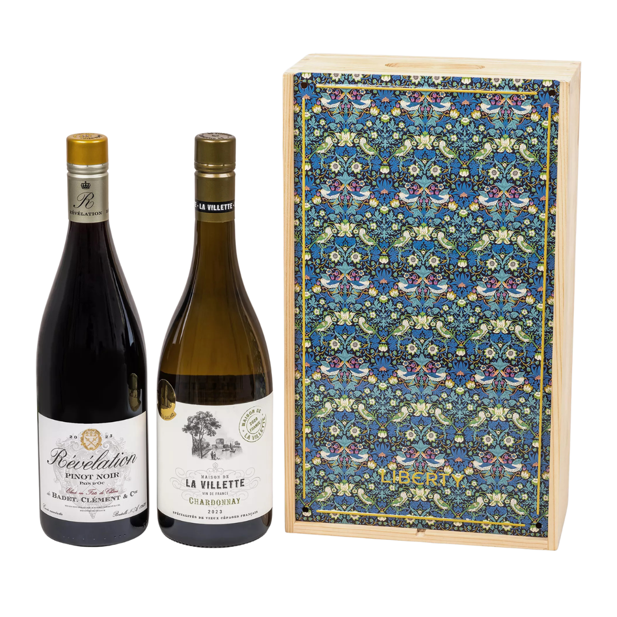 a bottle of red and white wine next to a wooden box in a blue and green liberty print