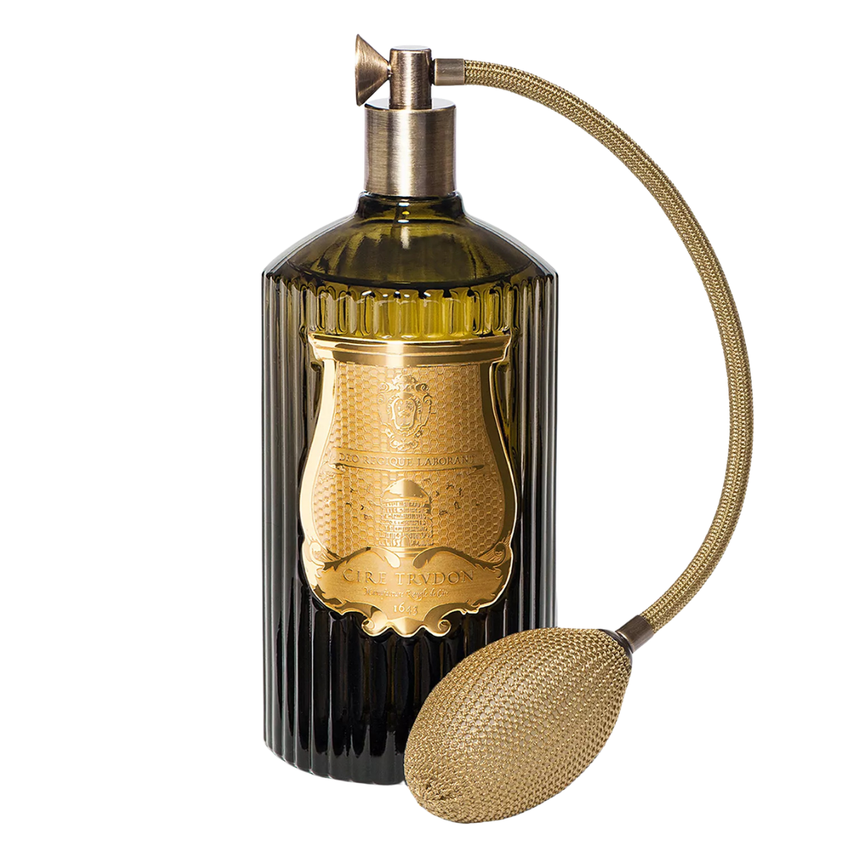a dark green ribbed glass bottle with a gold label and gold pump