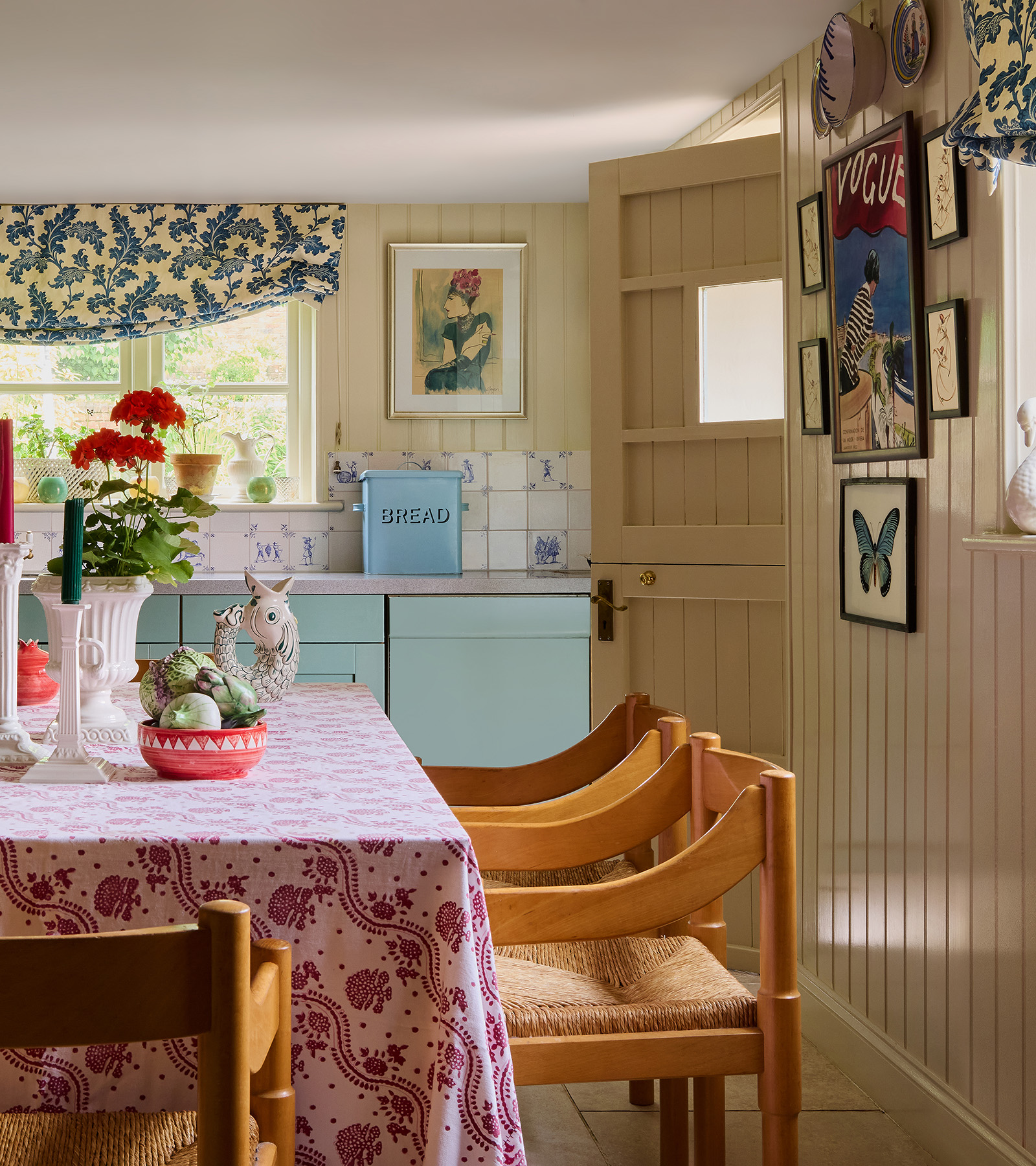 a country kitchen with floral tablecloth
