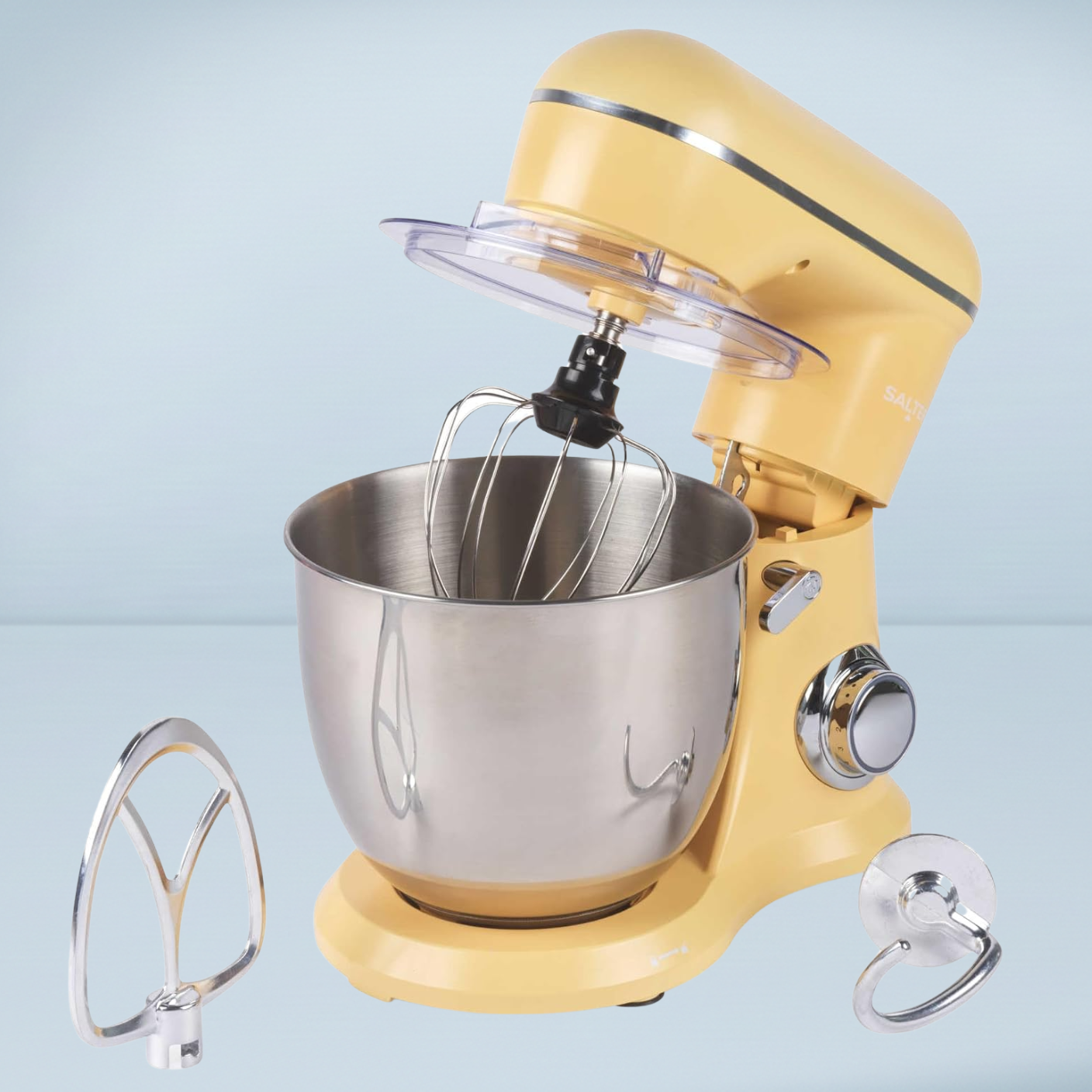 a pale yellow stand mixer with attachments