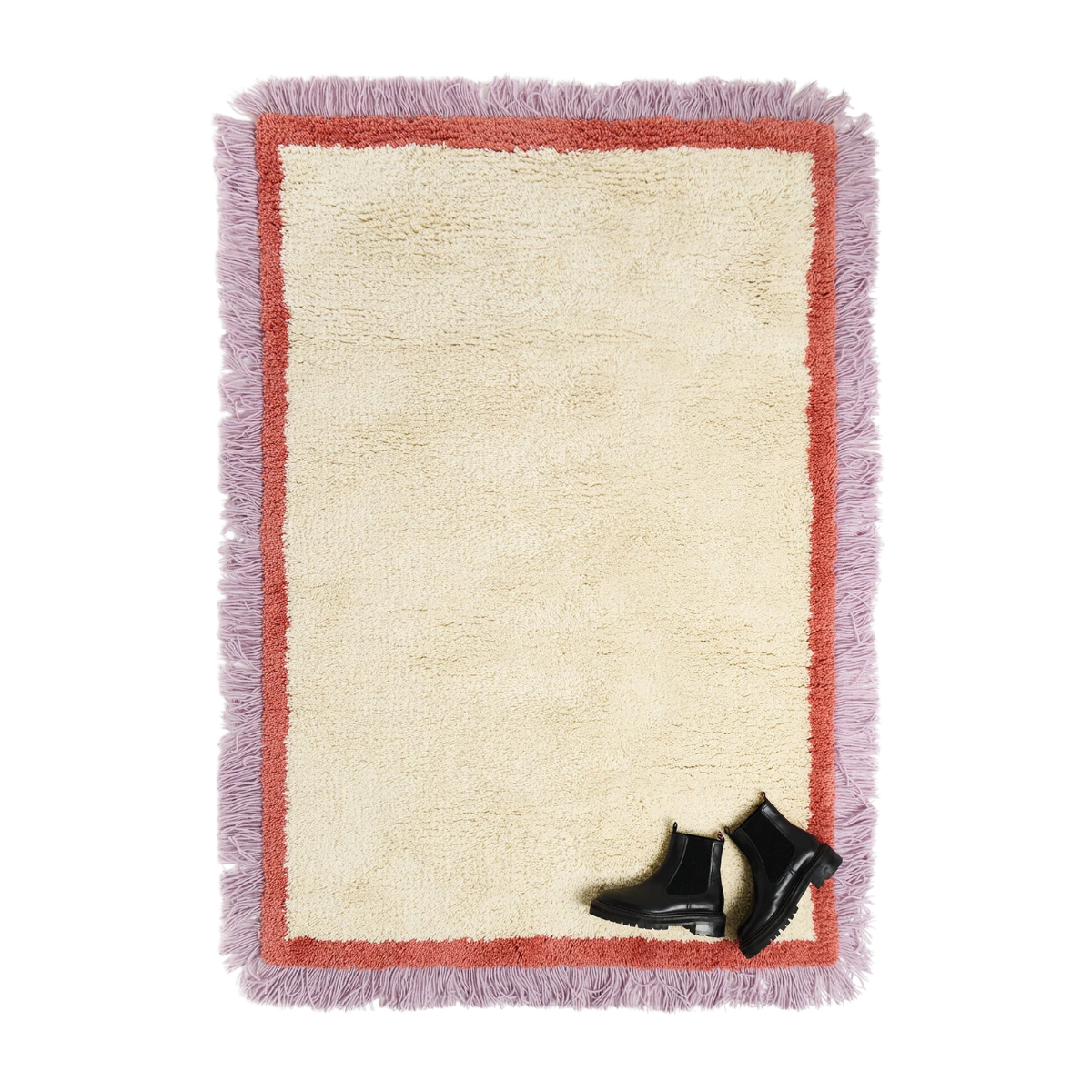 a fluffy cream rig with a lilac and red fringed border