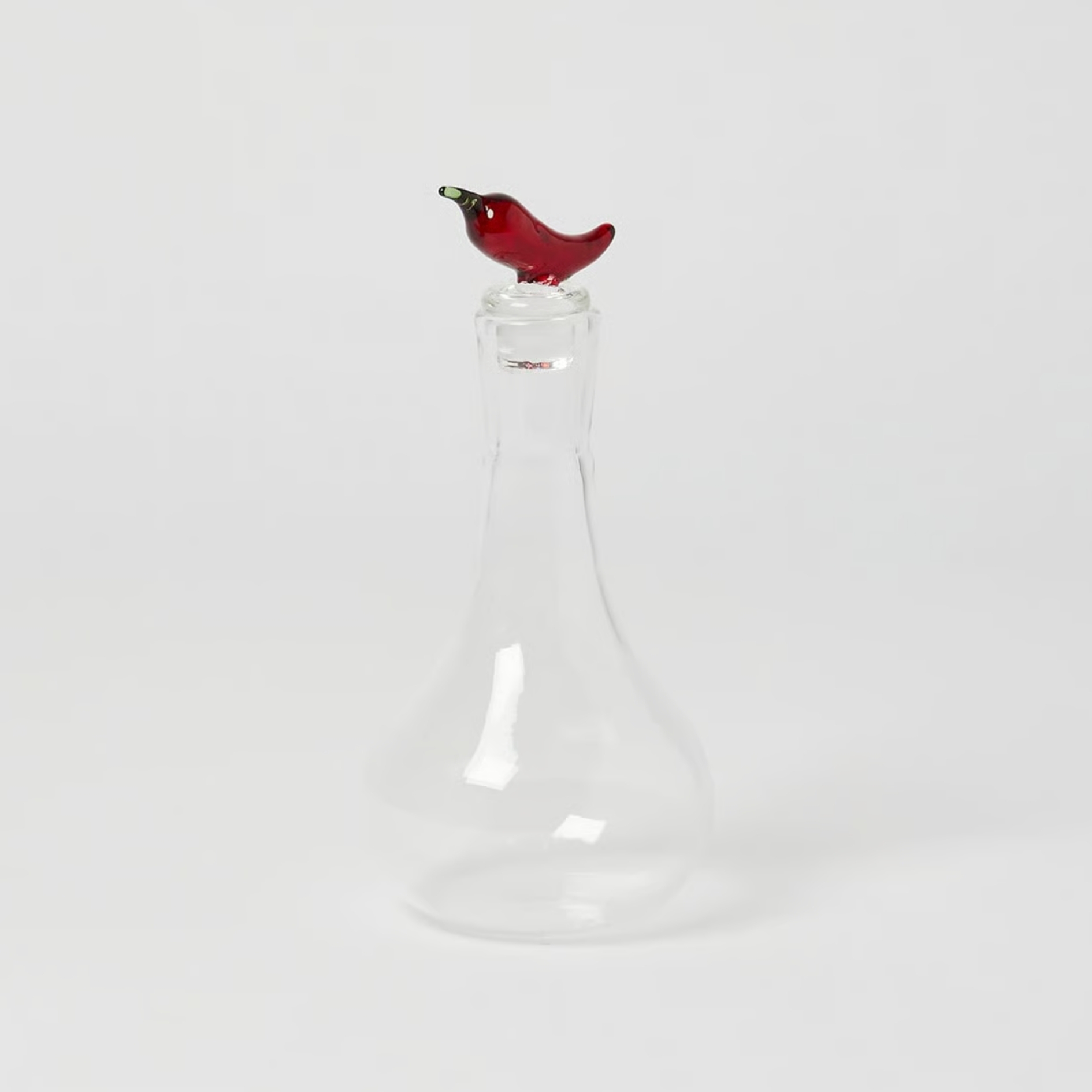oliver bonas Glass Oil Bottle pictured on a grey background