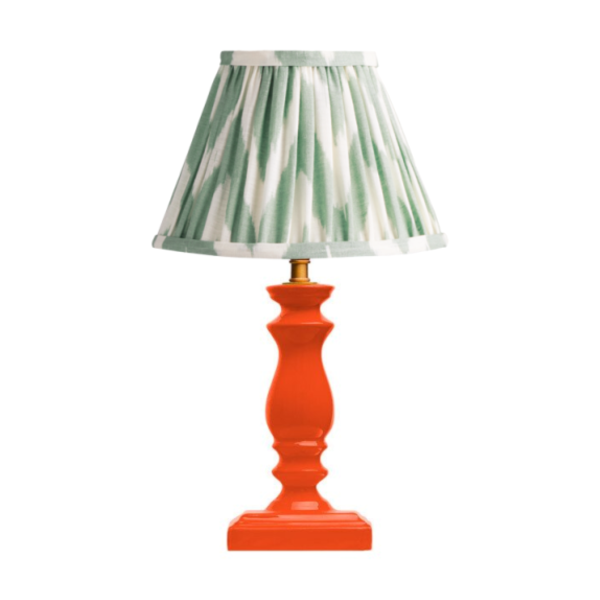 orange lamp with green patterned shade