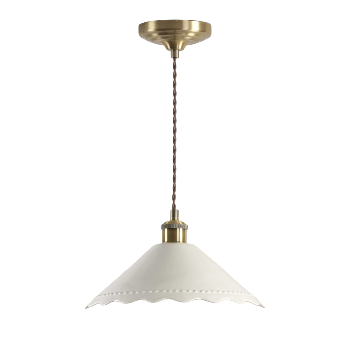 a white scallop lampshade with gold fixtures