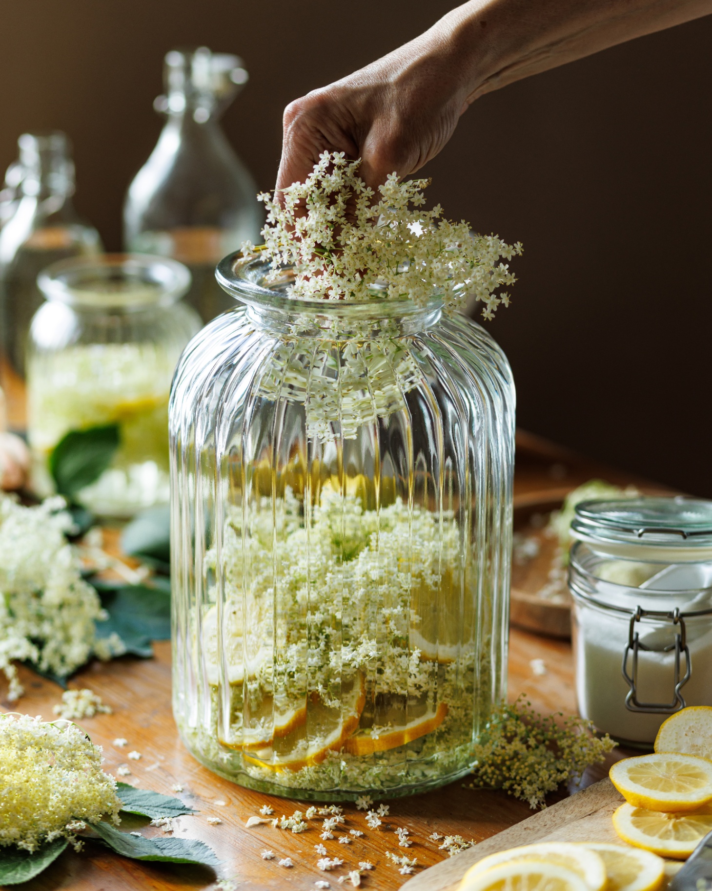 homemade elderflower cordial in a large ribbed glass jar