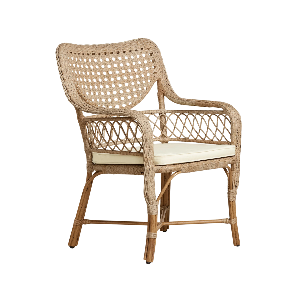 a rattan chair with a cream seat pad
