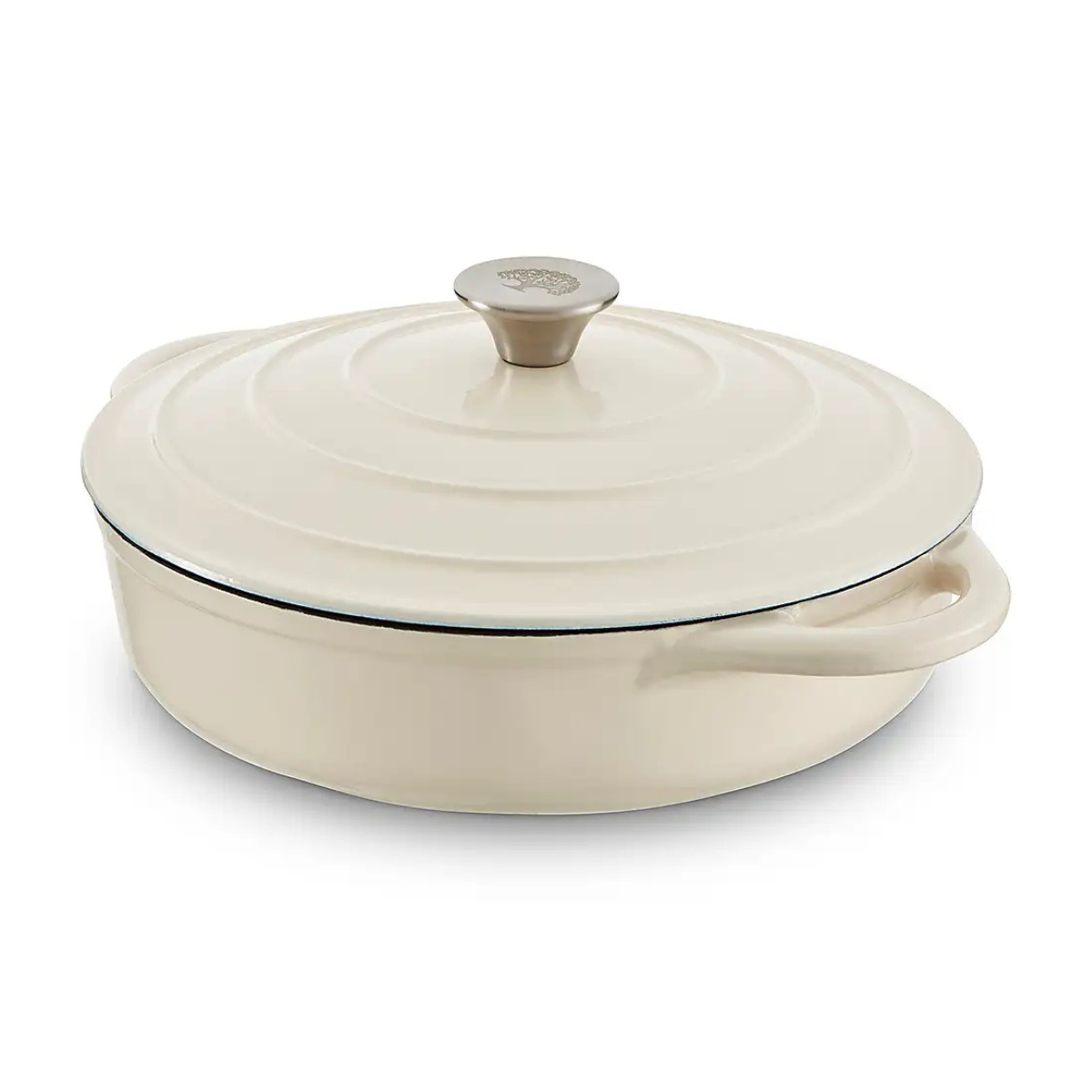 a cream shallow cast iron dish with matching lid on a white background