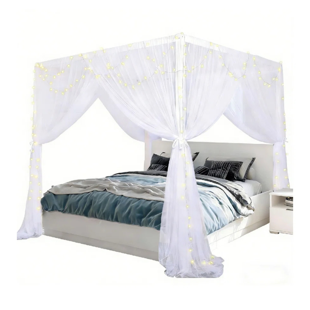 white sheer bed canopy curtains on a white four poster bed frame with blue bedding