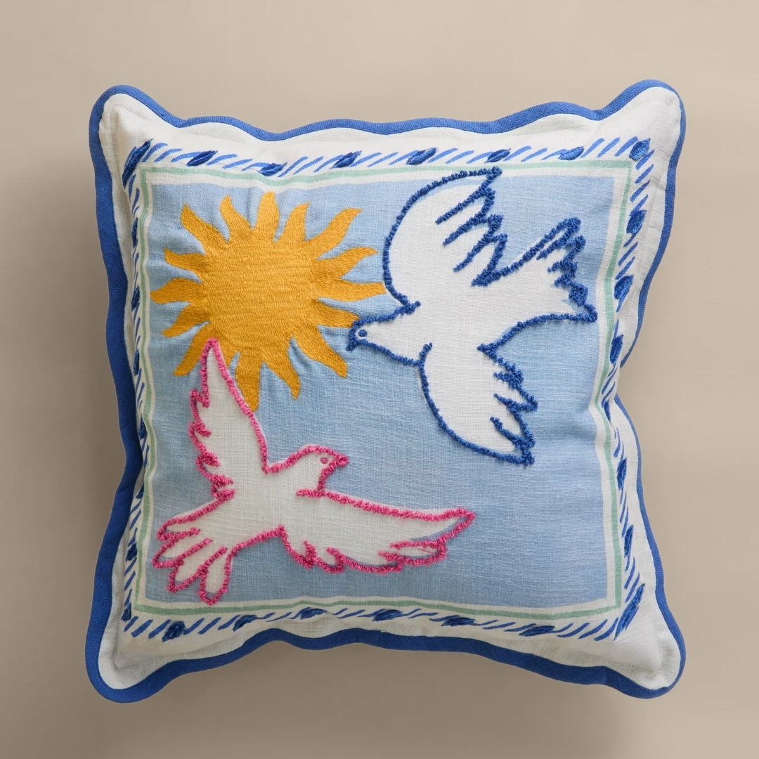 Pure Cotton Dolce Vita Bird Outdoor Cushion pictured on a beige background