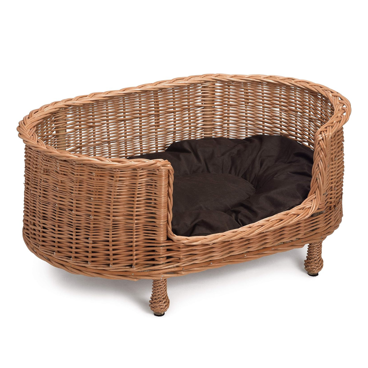 a wicker dog bed with brown cushion