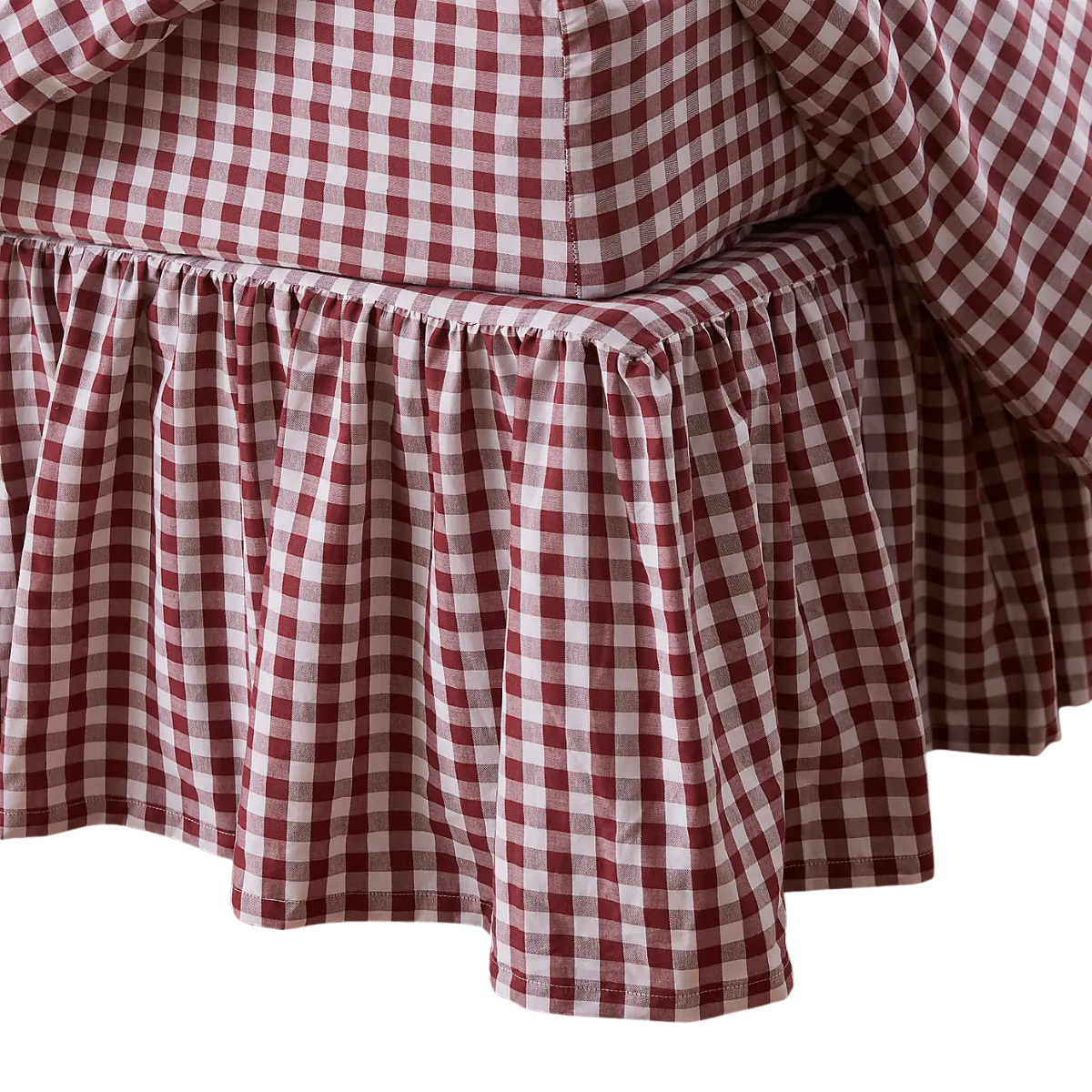 a red and white gingham frilled bed valance