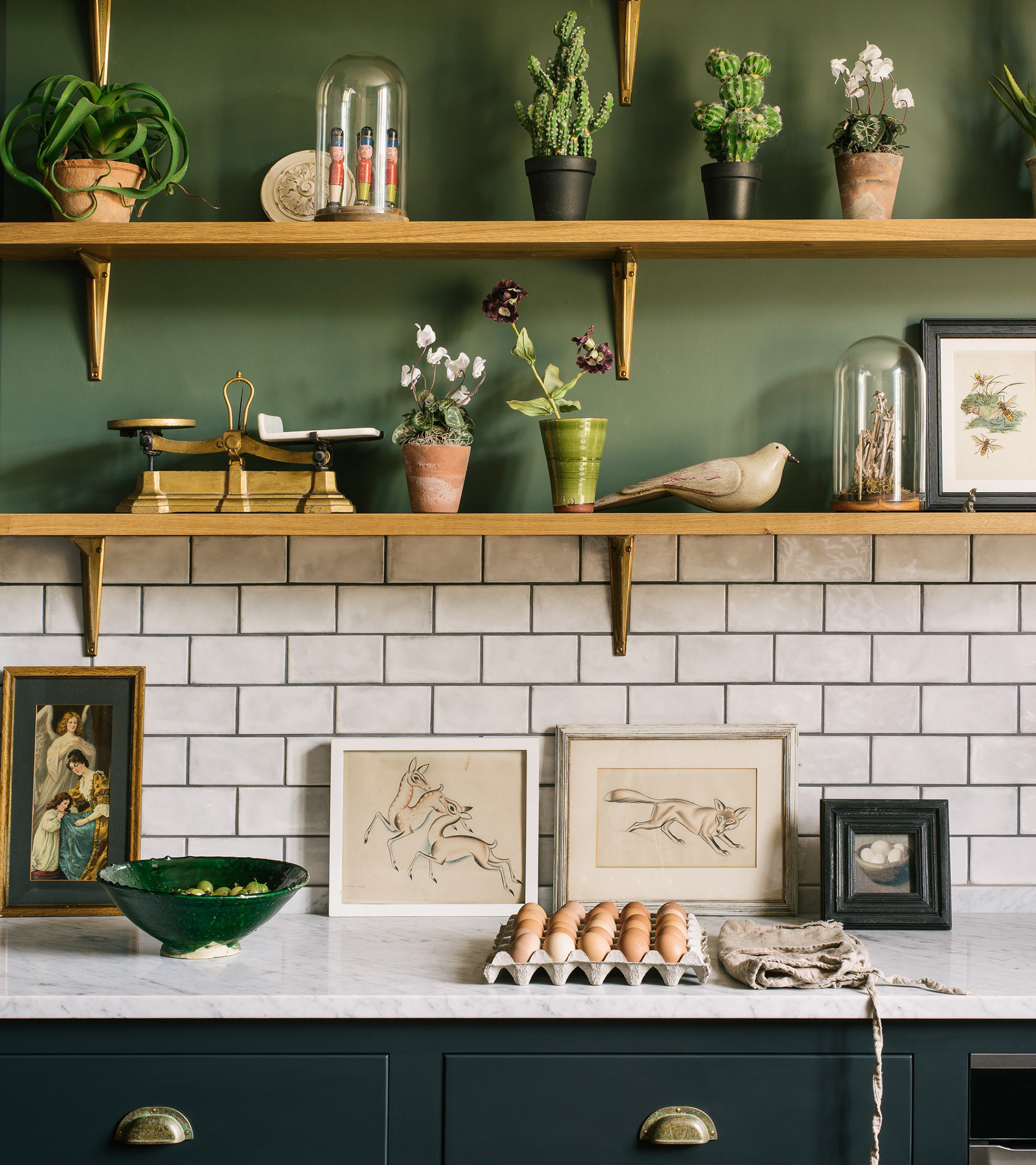 green kitchen with open shelves