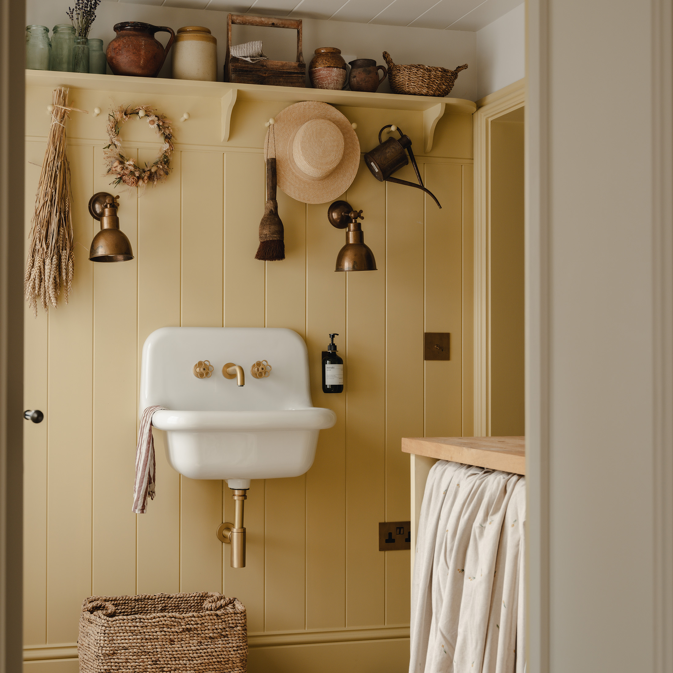 pastel yellow utility room