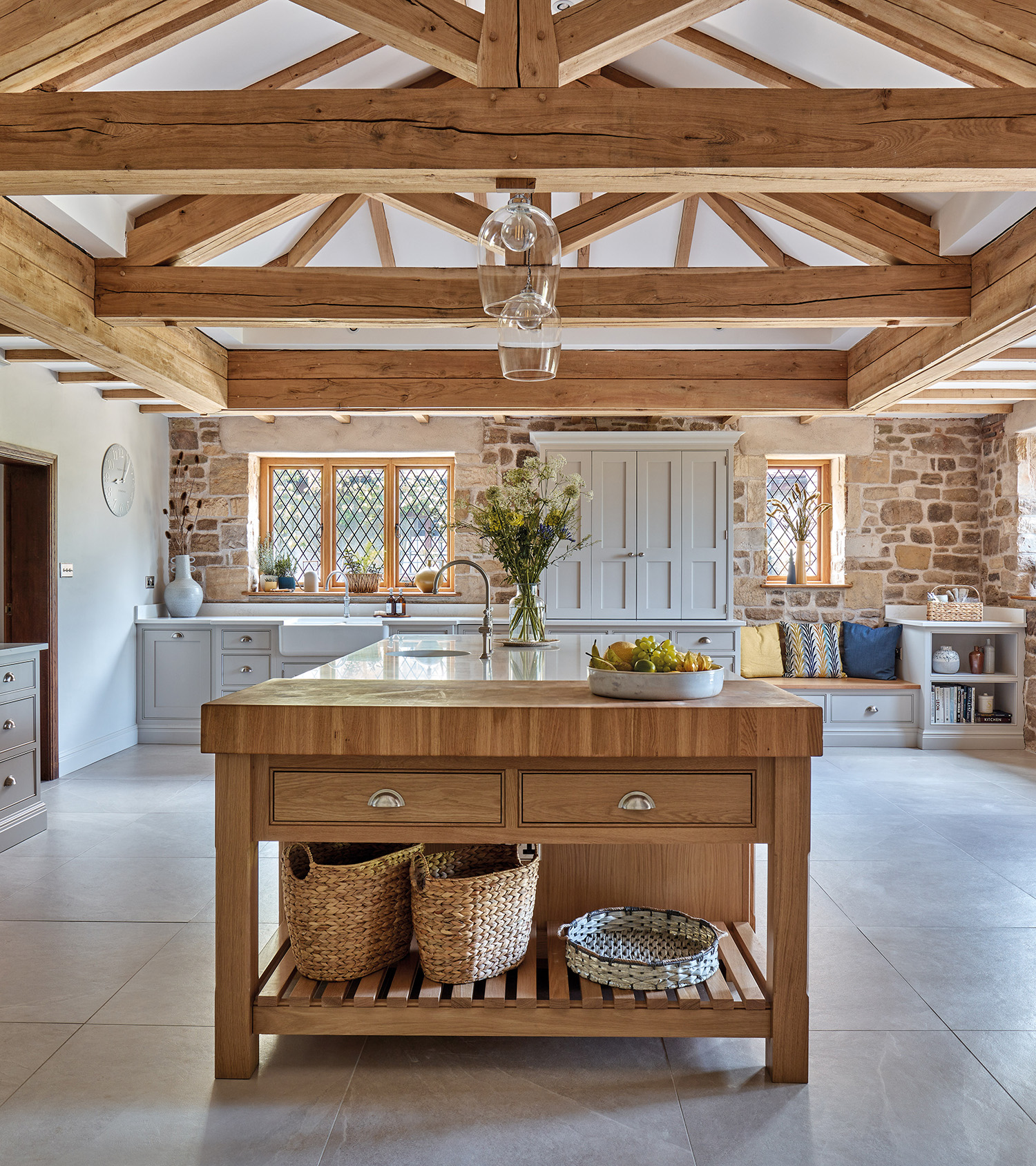 neutral kitchen with wooden island and beams