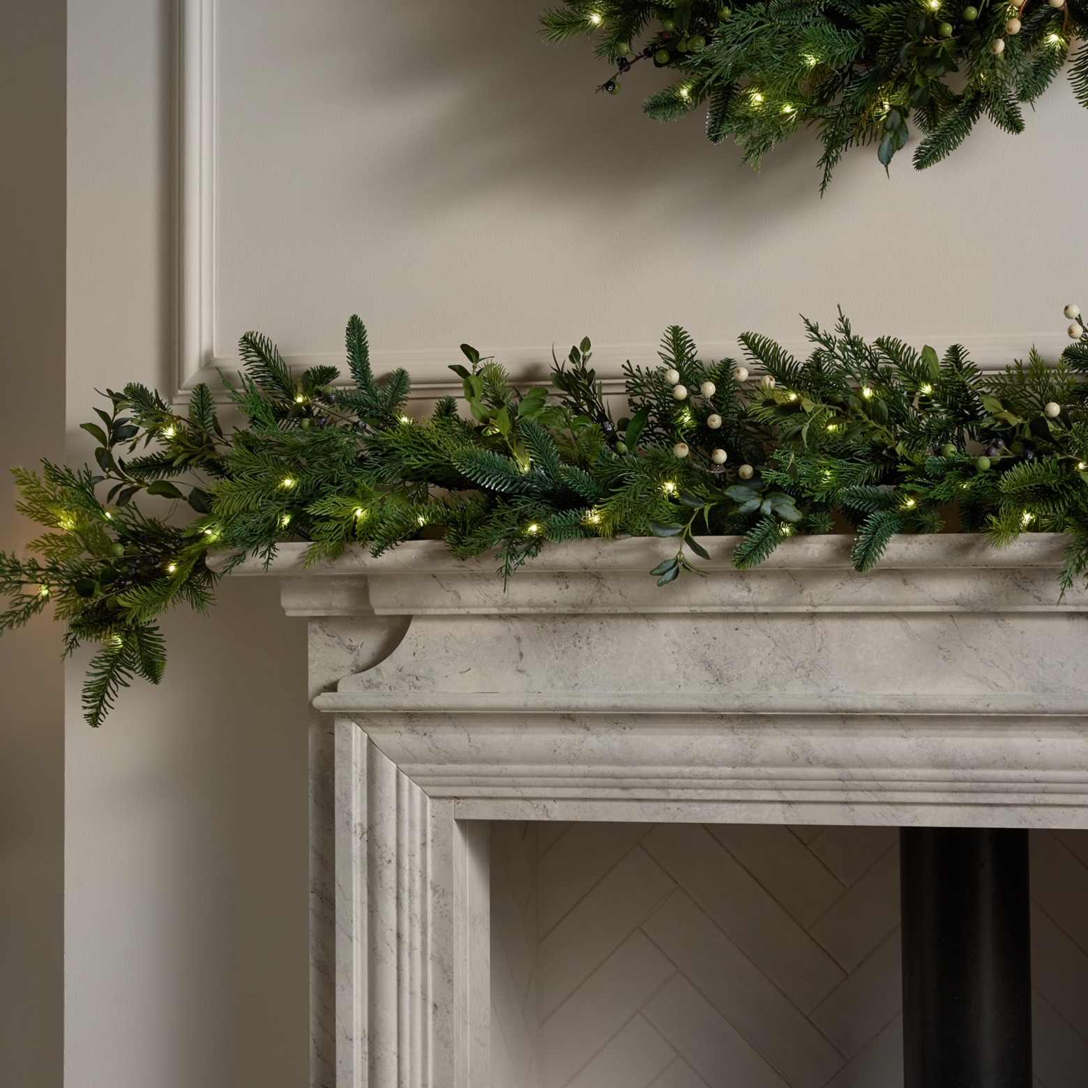 a garland on a marble fireplace